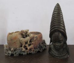 A carved soapstone model, together with a carved stone ethnic bust