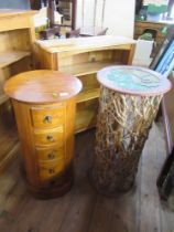 A circular chest of drawers, together with a jardinière stand with stained glass top raised on stick