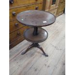 A 19th century mahogany two tiered dumb waiter diameter 19ins height 27ins