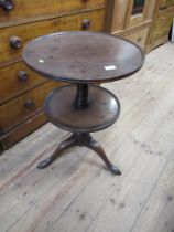 A 19th century mahogany two tiered dumb waiter diameter 19ins height 27ins