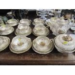 A collection of 19th century tea ware, possibly Rockingham, each piece individually decorated with