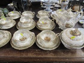 A collection of 19th century tea ware, possibly Rockingham, each piece individually decorated with