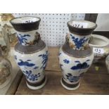 A pair of oriental vases decorated with flowers, birds and insects, height 8.5ins Condition Report: