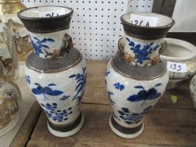 A pair of oriental vases decorated with flowers, birds and insects, height 8.5ins Condition Report: