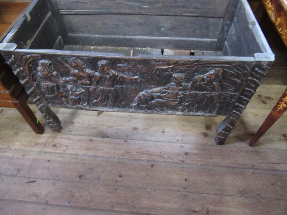 An antique oak coffer with plain raising lid the sides having fielded panels with carved decoration, - Image 3 of 5