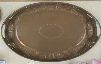 A Newlyn copper oval gallery tray, embossed with fish, diameter 21.5ins