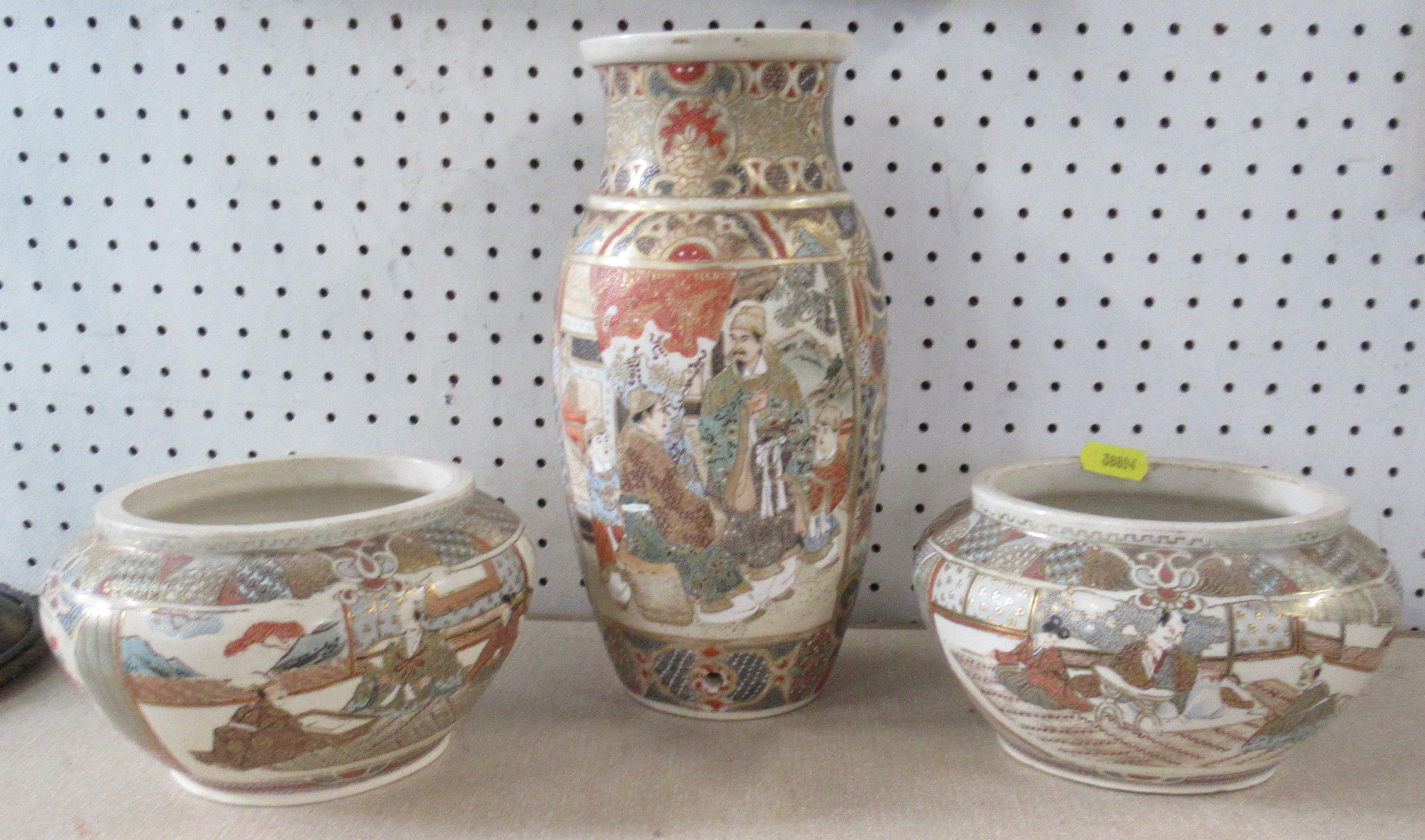 A pair of Satsuma pottery oval vases, decorated with figures, height 4ins, together with a similar