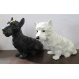 Two painted metal models of Scottie dogs, white and black, height 7.5ins