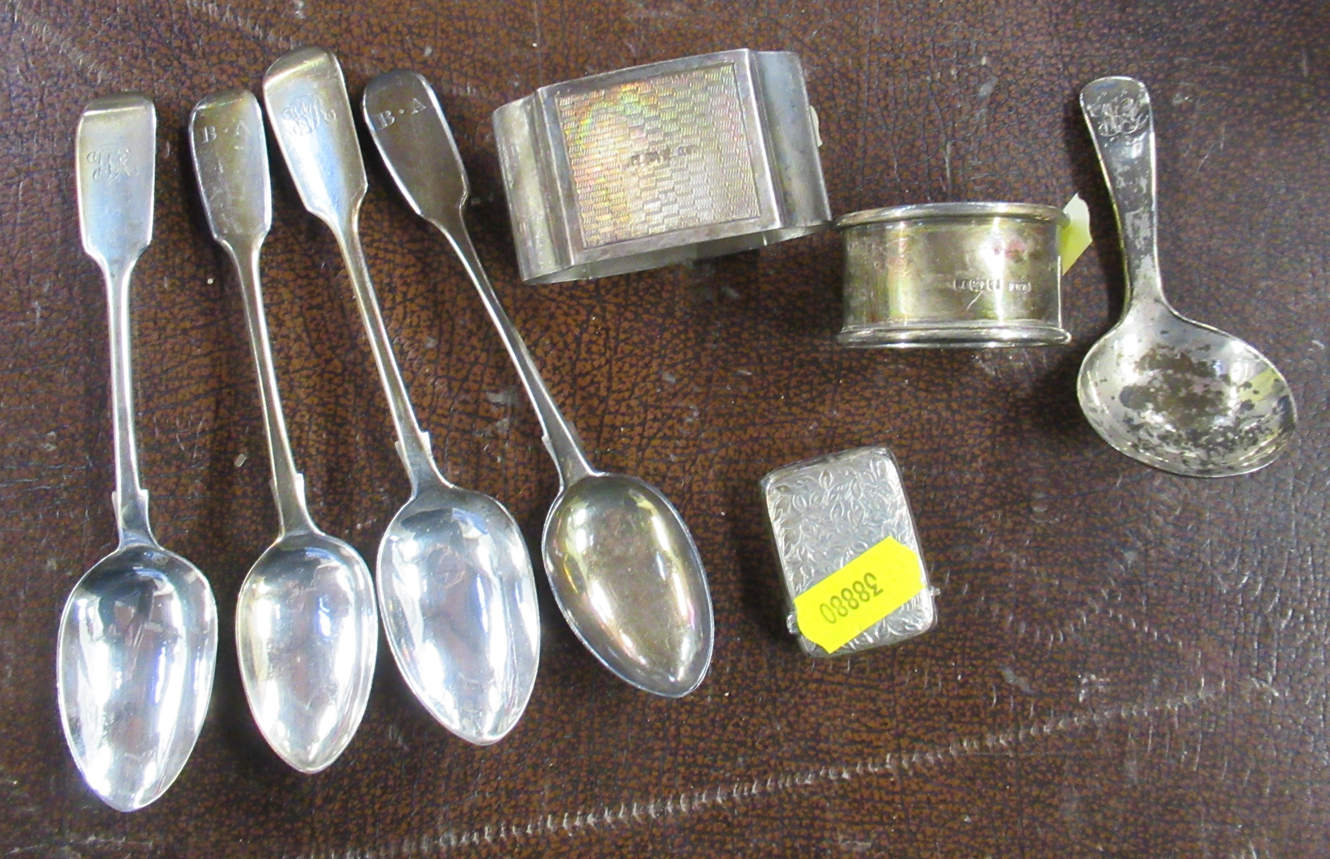 A collection of silver, to include tea spoons, caddy spoon, napkin rings and vesta case, weight 5oz