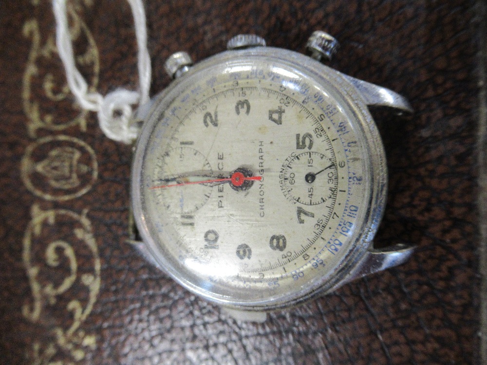 A pierced Chronograph watch stamped 4397 to the back