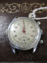 A pierced Chronograph watch stamped 4397 to the back