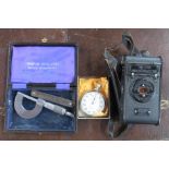 A vest Pocket Kodak camera, together with a Nero Lemania stop watch and a gauge