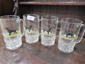 Four glass tankards decorated with Labradors