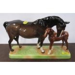 A Beswick model, bay mare and foal, on rectangular base, height 6.5ins