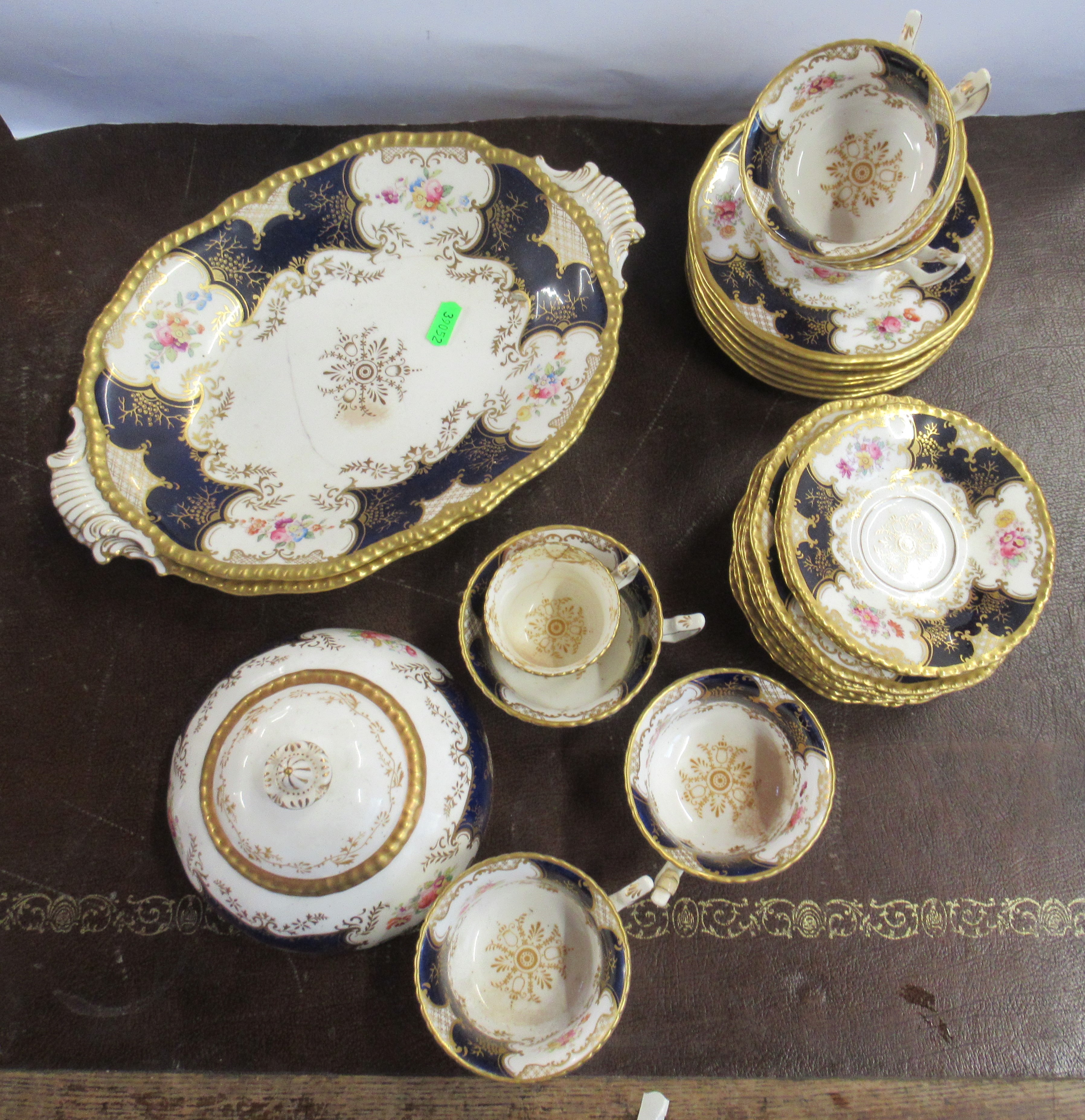 A Coalport part tea service, decorated with flowers to a gilt and blue ground Condition Report: - Image 2 of 3