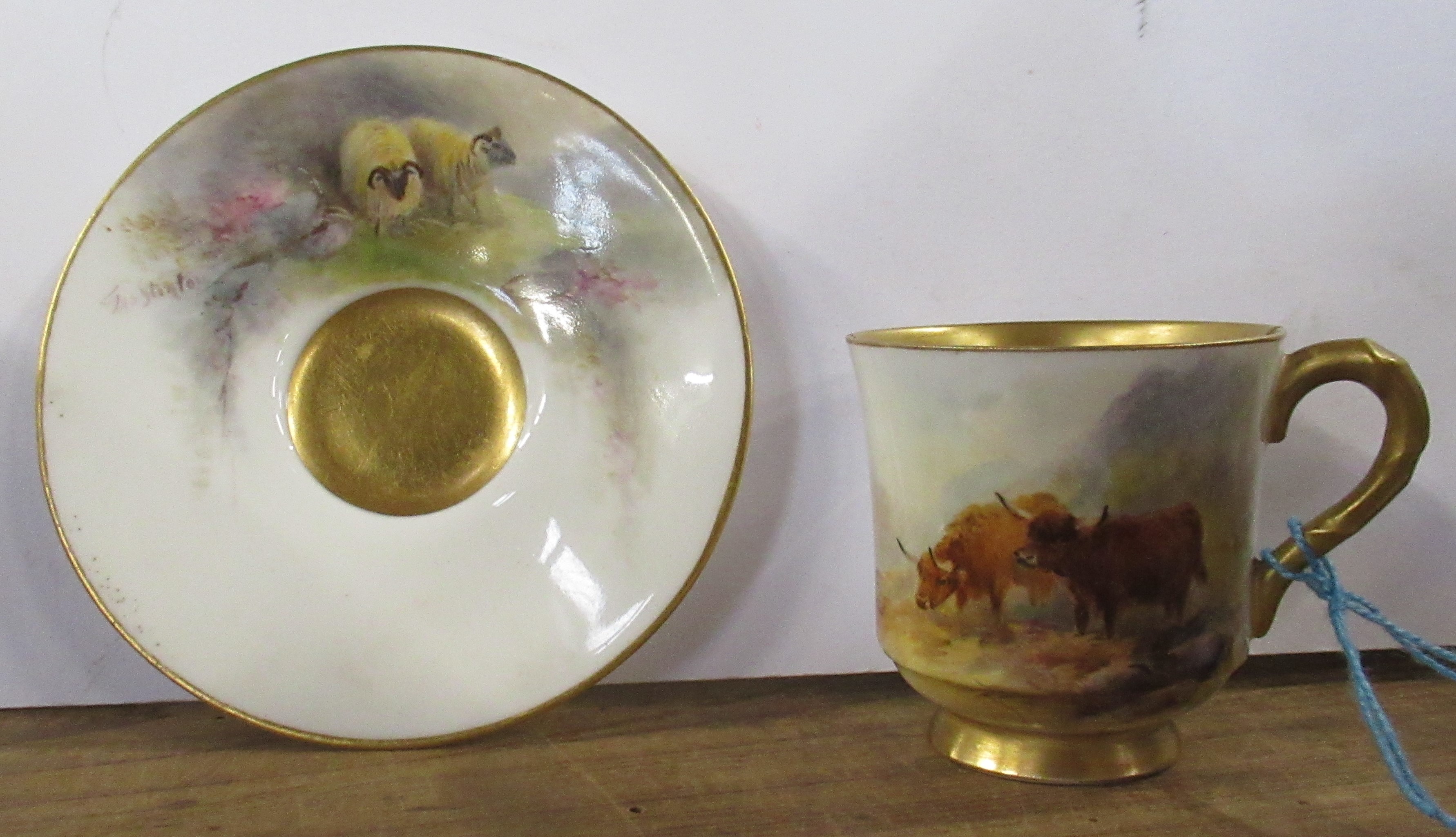 A Royal Worcester miniature saucer, decorated with sheep, signed Jas Stinton, together with a