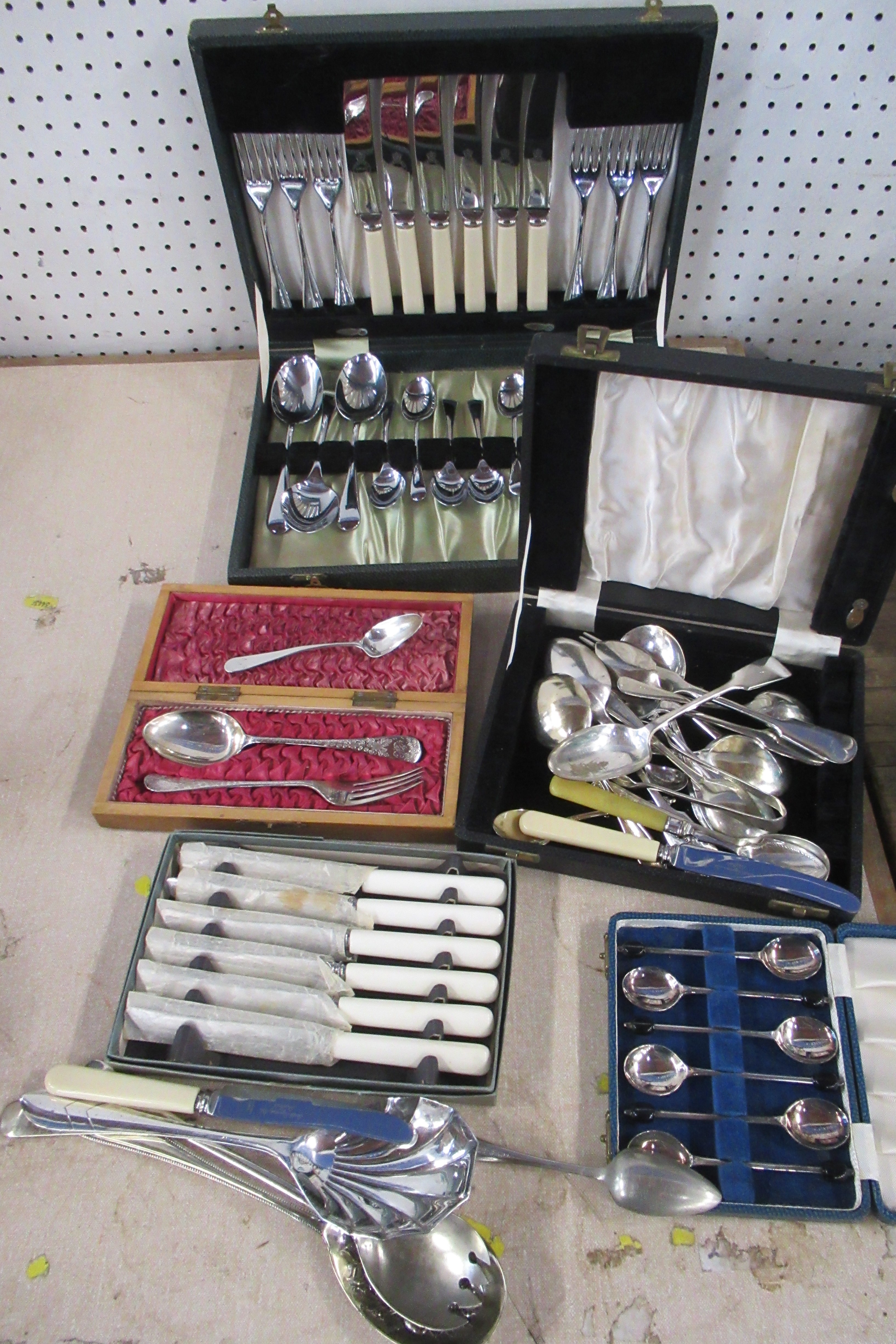 A cased silver fork and spoon, together with other cutlery, some boxed