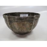 A hallmarked silver bowl inscribed with crest arm holding a crown, weight 3.8oz diameter 4.5ins