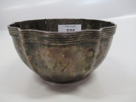 A hallmarked silver bowl inscribed with crest arm holding a crown, weight 3.8oz diameter 4.5ins