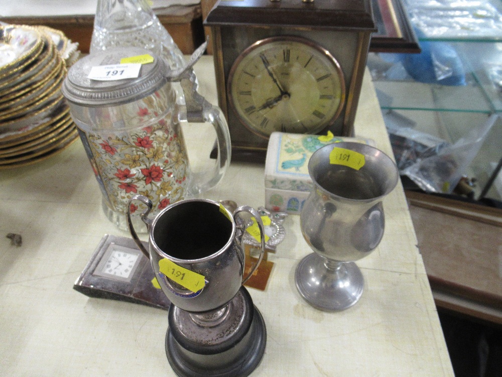 A hallmarked silver trophy together with Meta Mac mantel clock, Silver napkin ring, clocks etc