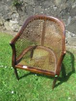 A mahogany framed child's chair, with caned seat and back