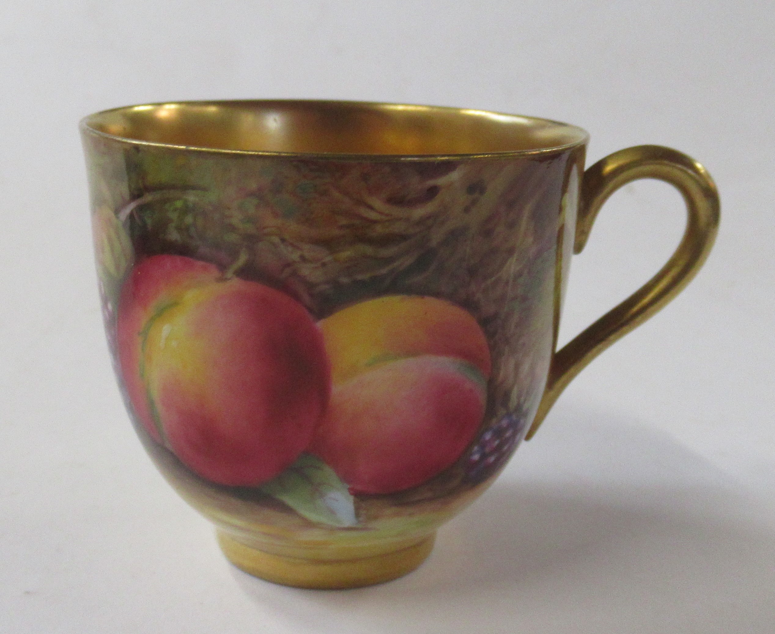 A Royal Worcester cabinet cup and saucer, decorated with fruit to a mossy background, the cup by E - Image 4 of 8