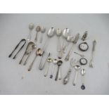 A collection of silver flatware,  to include spoons and sugar tongs, weight 14oz, together with