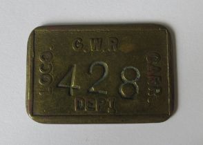 A G.W.R brass Loco Carr Dept. pay cheque, numbered 428