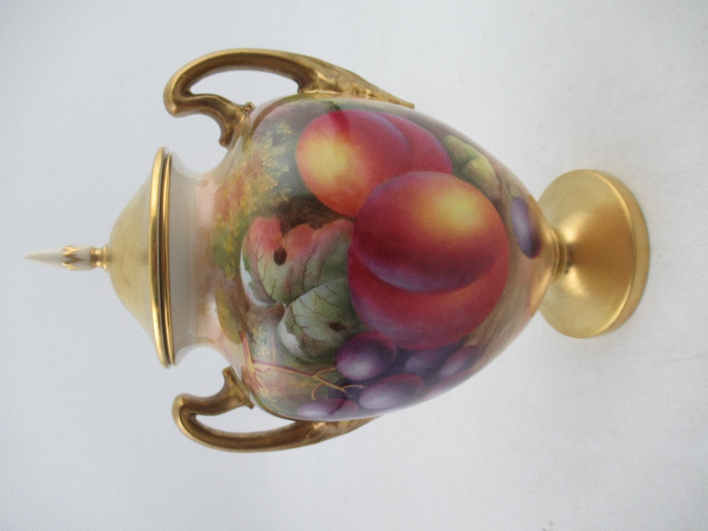 A Royal Worcester porcelain covered vase decorated half round with hand painted fruit by Ayrton