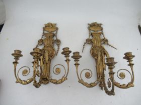 A pair of  Antique Chippendale style wood and gesso gilt three light candelabra surmounted by an urn