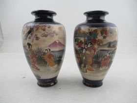 A pair of 20th century Satsuma vases, decorated with figures in landscape, height 7.5ins