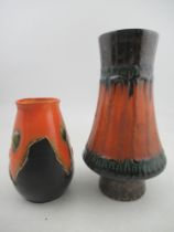 A Bretby vase, in orange and black, numbered 3360, height 7.5ins, together with another vase, height