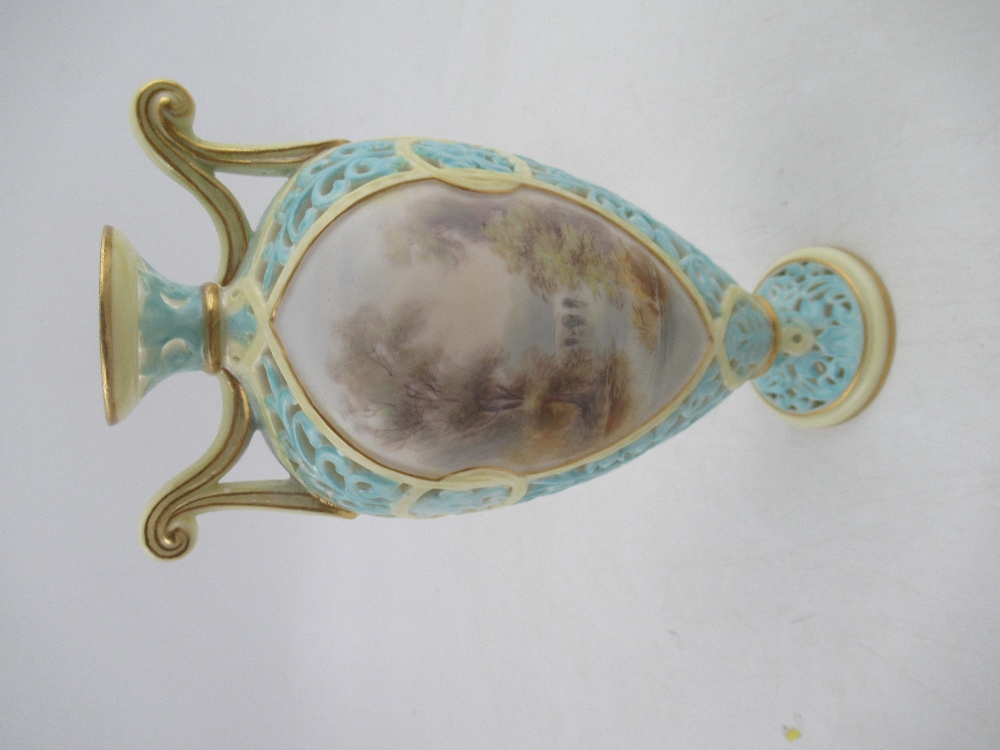 A Grainger's  Worcester turquoise pierced vase with reserved landscape panels, height 7.5ins