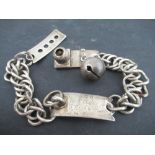 A Barrett & Sons London, a silver cat or dog collar, with curb links and engraved plaque, with bell,