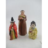 Three Royal Worcester candle snuffers, a monk, a witch and a Japanese girl