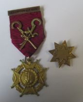 A 9ct gold star shaped medal, weight 7.2g, together with a 9ct Lodge medal and ribbon, weight