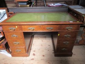 An oak twin pedestal desk, 48ins x 27ins, height 31ins