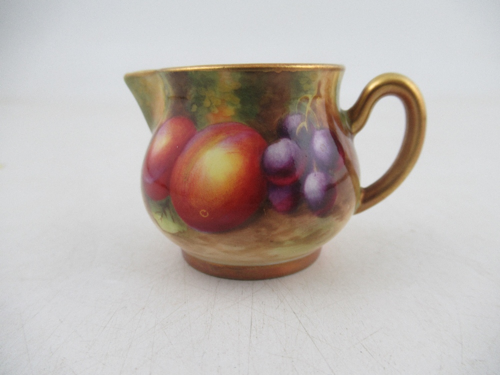 A Royal  Worcester miniature jug decorated with hand painted fruit by Ayrton  Condition Report: Good
