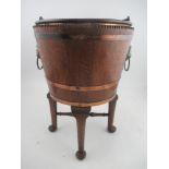 A 19th century coopered oak copper banded wine cooler with lift out liner