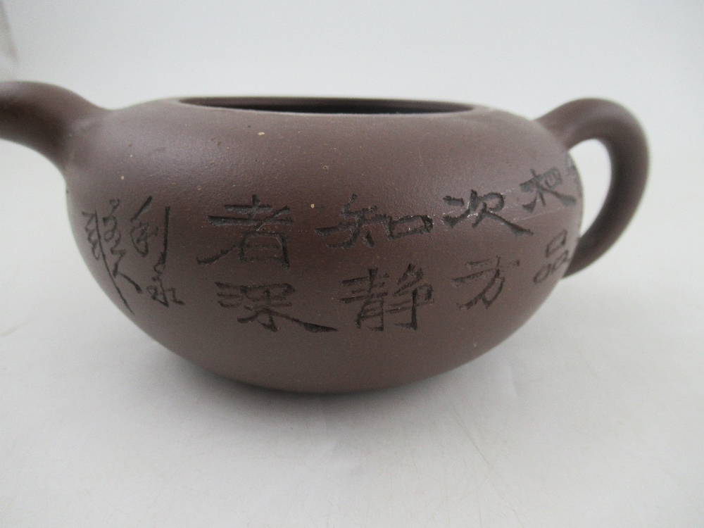 A Chinese Yixing style terracotta teapot, incised with a landscape and script, with seal mark, - Bild 5 aus 5