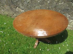 Foxman Don Craven (Boroughbridge), an oak circular dining table with adze top, diameter 48ins,