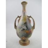 A Royal Worcester vase, the front decorated with two storks wading by Lewis and a landscape to the