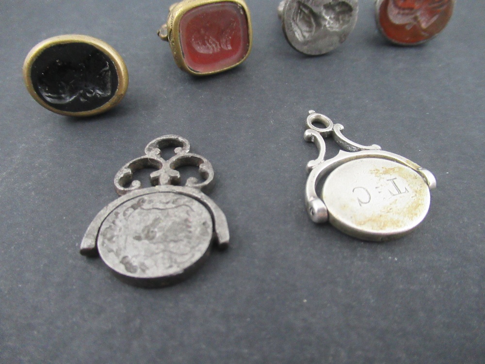 A group of Georgian and later desk seals, two with swivel action, one engraved with a ship, the - Image 4 of 4
