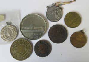 A collection of medals and tokens, to include the International Exhibition, Kingswood & District