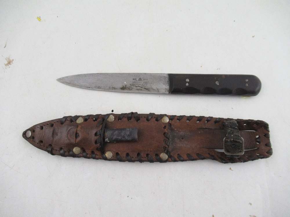 A Gregory Bros. Sheffield Bee Hive sheath knife, in leather case, with smaller knife