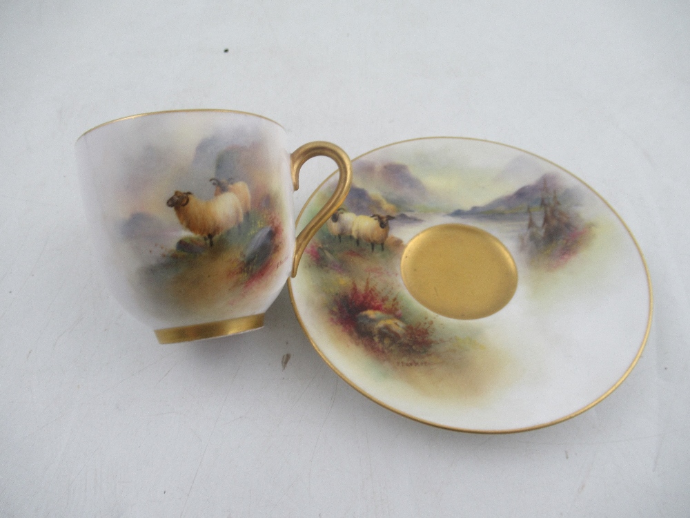 A Royal Worcester coffee cup and saucer decorated with cattle by H Stinton together with a coffee
