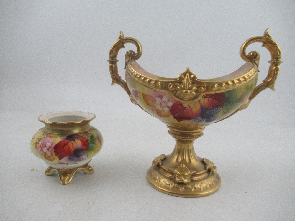 A Royal Worcester oval center piece, decorated with Autumnal leaves and berries by Kitty Blake,