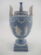 A Wedgewood Blue Jasper covered  vase decorated all around with classical figures and two hoop