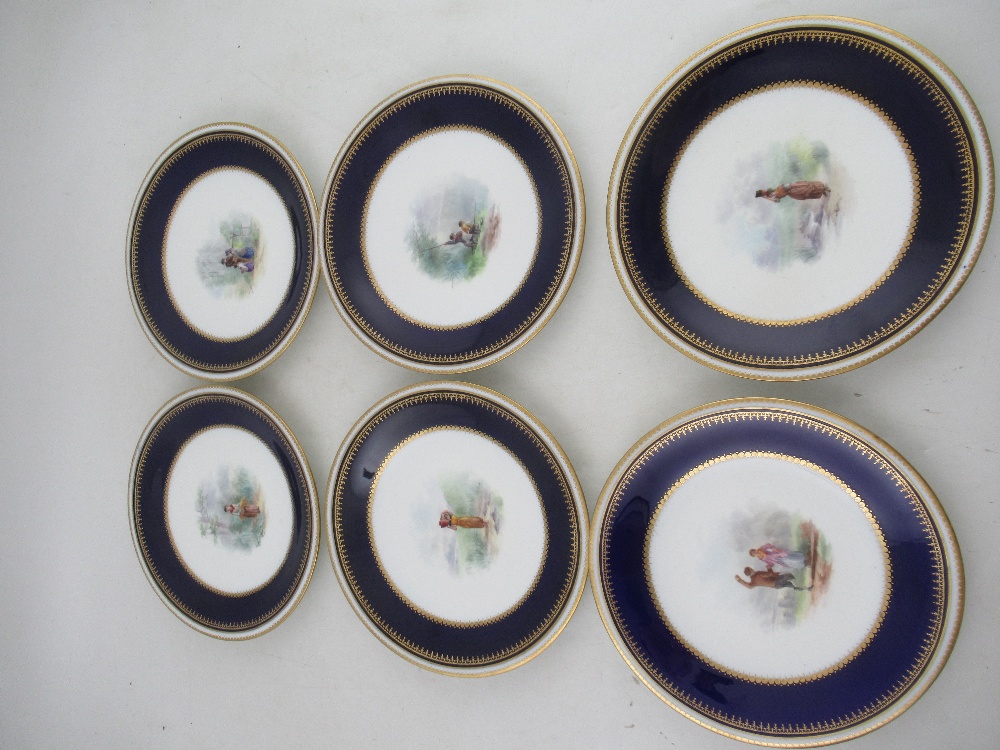 Six Grainger Worcester plates decorated with central panels of figures in a landscape to a deep blue