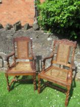 A pair of armchairs, with caned back and seats and carved decoration